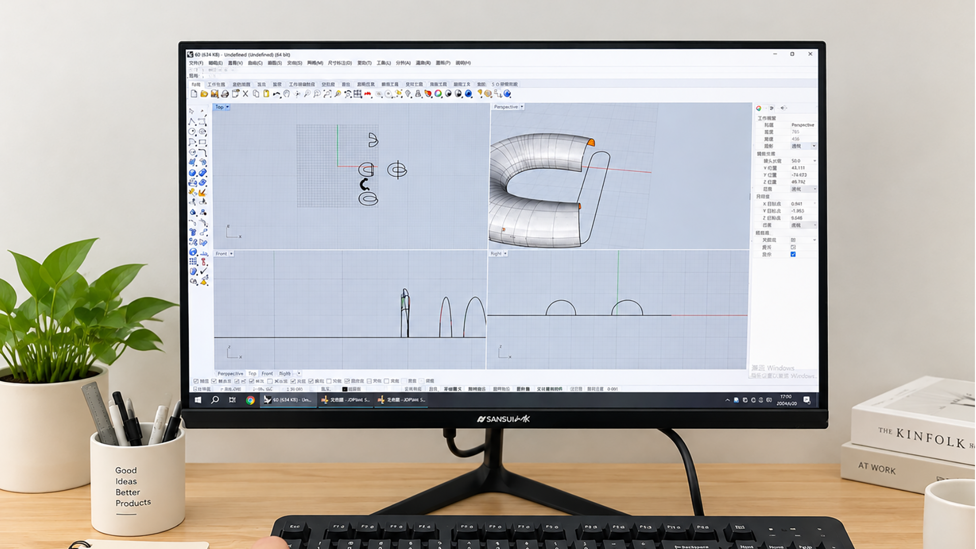 Belt buckle development drawings and samples on a product development worktable